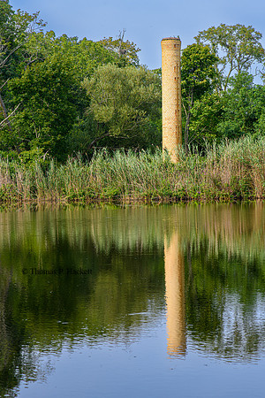 Smokestack and reflection